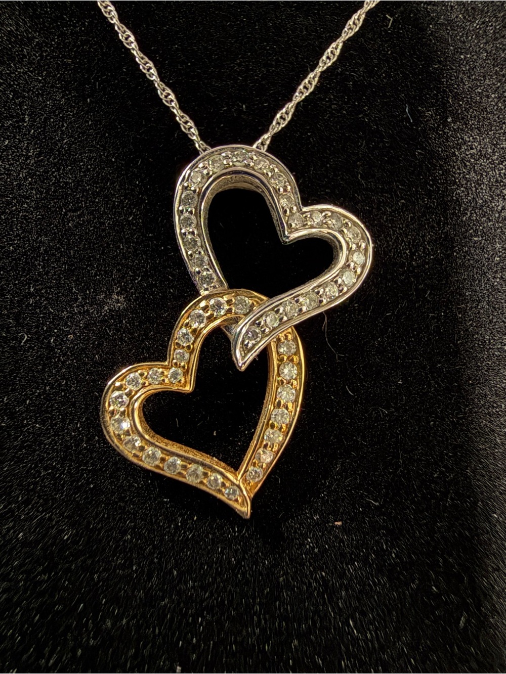 Kay Jewelers interlocking double heart pendant necklace with diamond accents.
